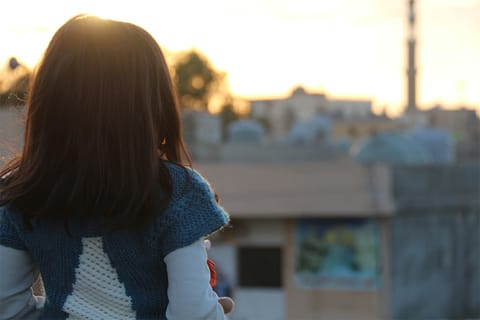 Migration: a girl from the back