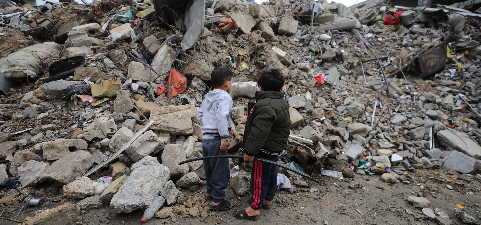 Two boys standing in front of rubbles, Gaza