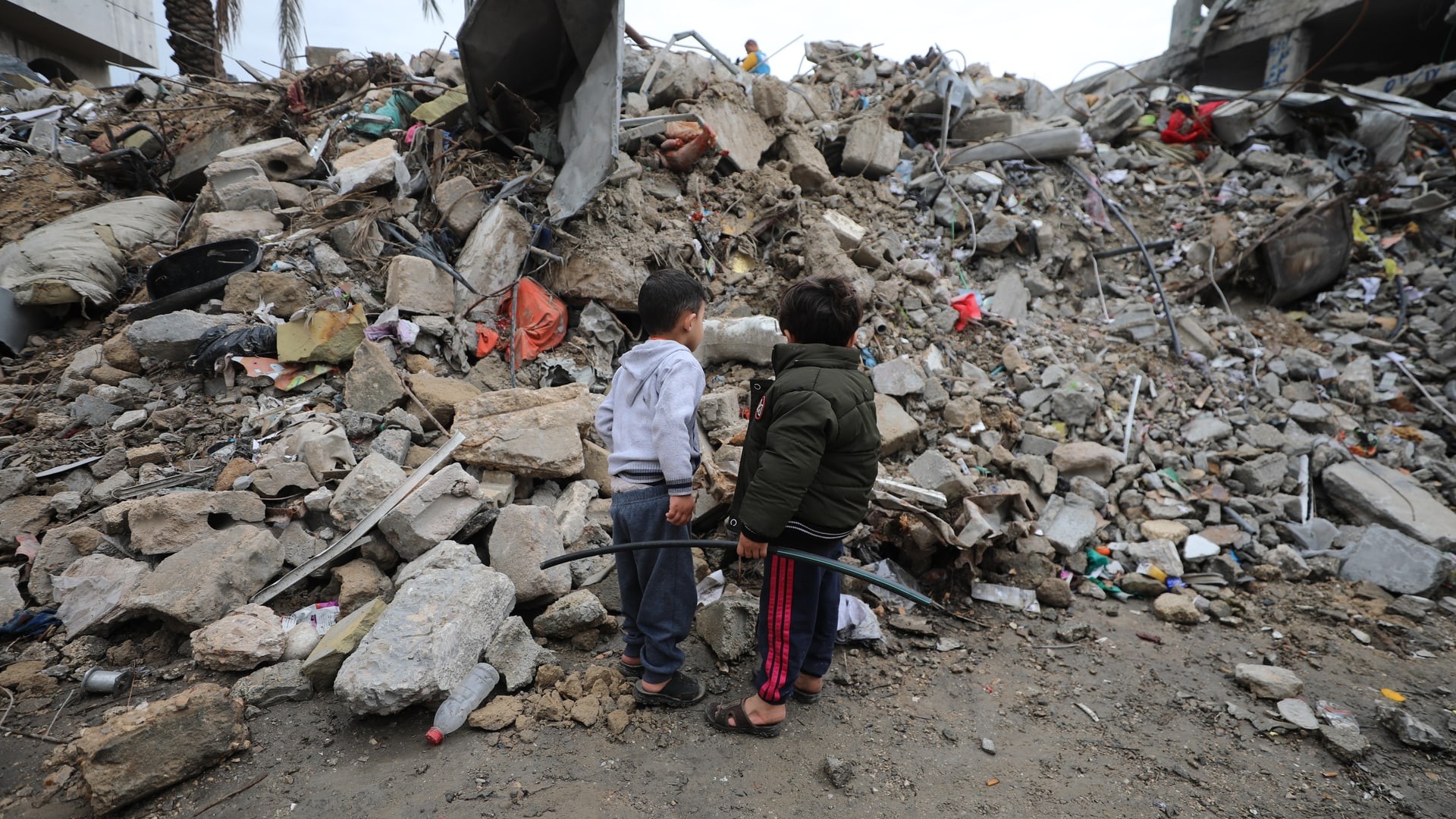 Two boys standing in front of rubbles, Gaza