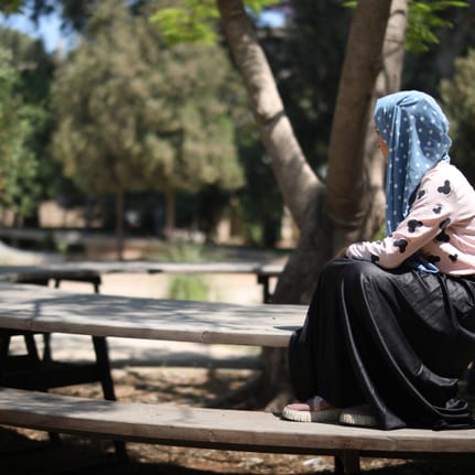 Young girl participating in an activity against early marriage in Lebanon